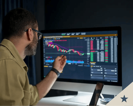 Asset manager reviews investment chart Asset manager reviews investment chart